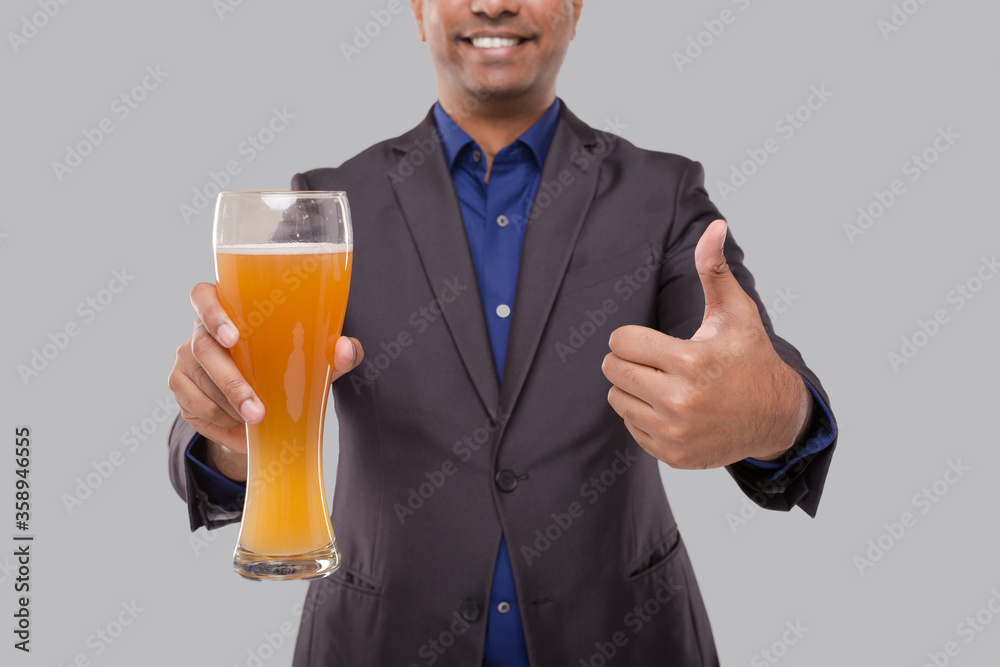 Businessman Showing Beer Glass and Thumb Up. Indian Business man with Beer in Hand Close Up Businessman Showing Beer Glass and Thumb Up. Indian Business man with Beer in Hand Close Up