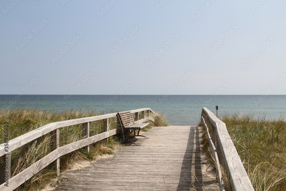 a wooden bridge as access to the beach on the Baltic Sea