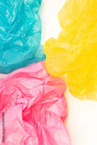 Wallpaper Mural 3 multicolour disposable plastic bags on white background.  Torontodigital.ca