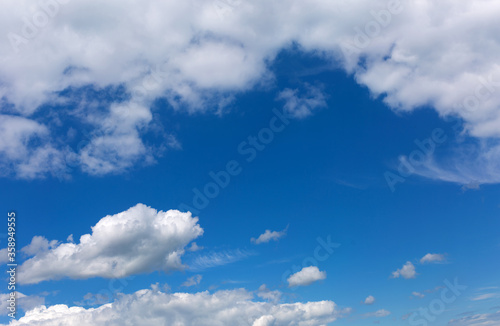 White clouds on blue sky background. © anya babii