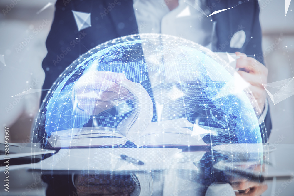 Double exposure of hands and notepad with business icons.