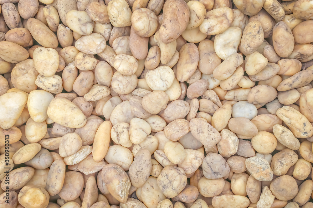 Naturally yellow white rock pebbles or stone background