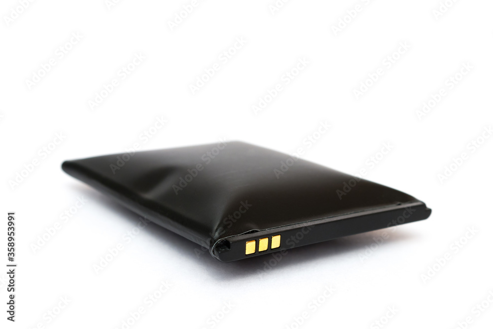 swollen battery from a mobile phone on a white background swollen battery from a mobile phone on a white background
