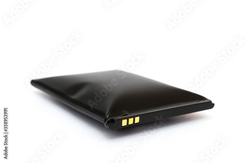 swollen battery from a mobile phone on a white background