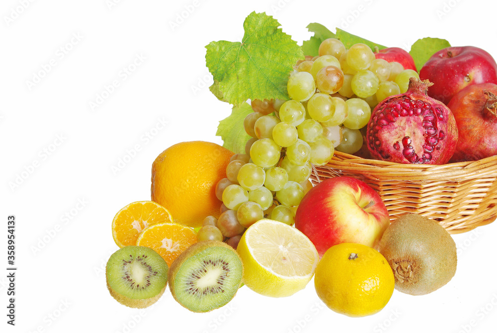 Sliced fruits and grapes on a white background. Sliced fruits and grapes on a white background.