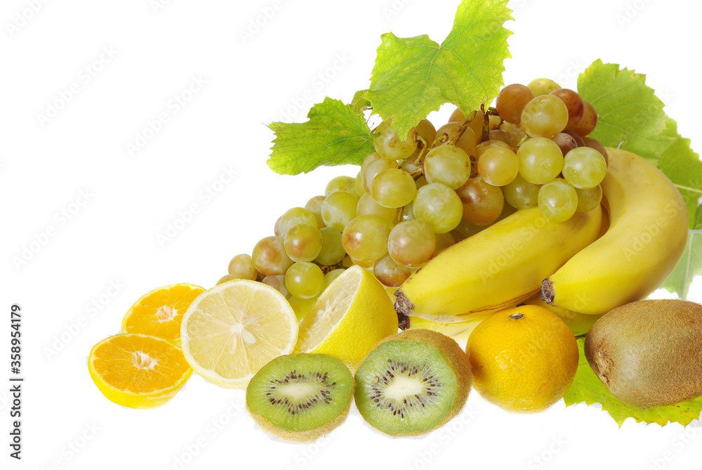 Sliced fruits and grapes on a white background. Sliced fruits and grapes on a white background.