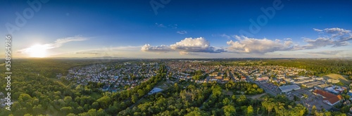 Aerial panoramic picture of the city Moerfelden in southern Hesse area during sunset