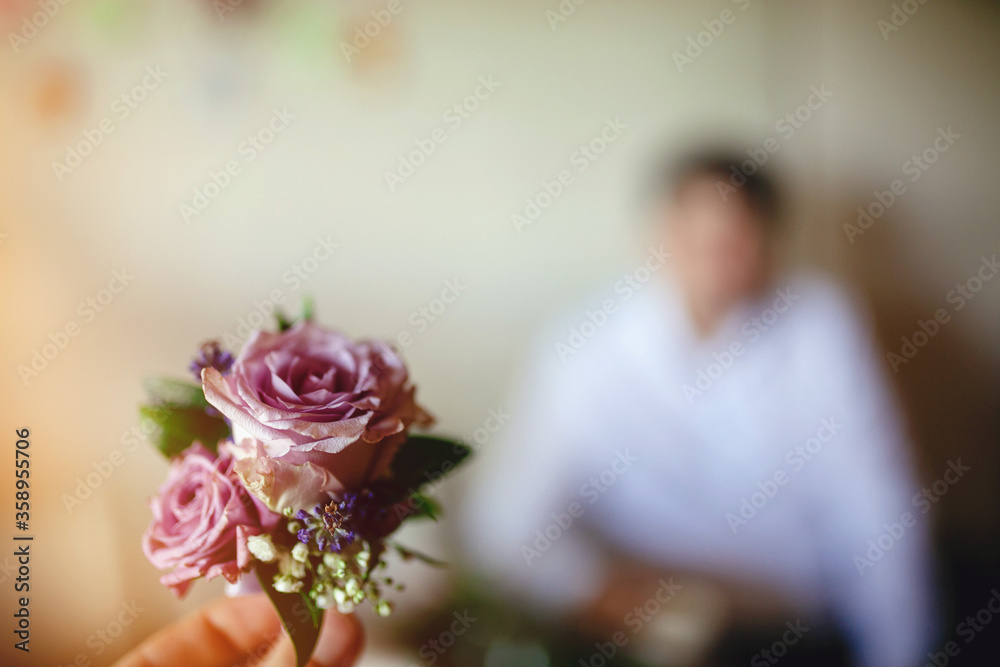 Boutonniere made of purple roses Boutonniere made of purple roses