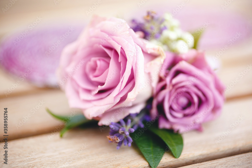 Boutonniere for groom made of purple roses Boutonniere for groom made of purple roses