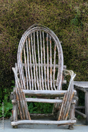 Fotografi Antiquity: very old rotten wooden chair with backrest from bygone times