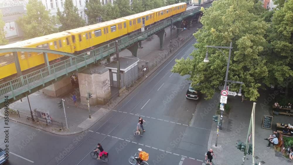 Berlin, Germany - June 19, 2020: The U-Bahn rapid transit railway passing above the Schönhauser Allee boulevard on an elevated railway in the Prenzlauer Berg district