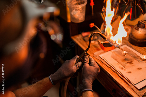 close-up. The jeweler makes a silver ring. On the island of Bali. Indonesia photo