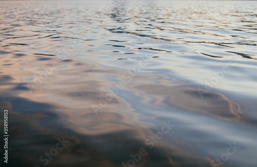 view of dark rippled lake water surface texture 