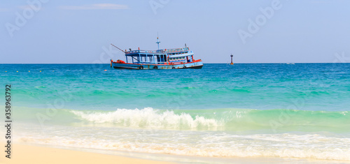 Beautiful tropical beaches and passenger transport boats.