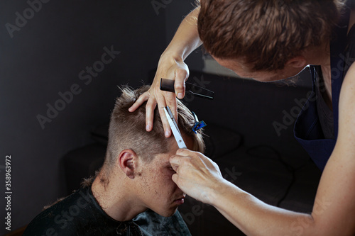 client cuts hair at the hairdresser, barbershop