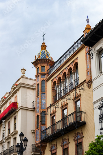 It's Architecture of the Constitution avenue of the Historic Centre in Seville, Spain. Historic Centre is protected by UNESCO