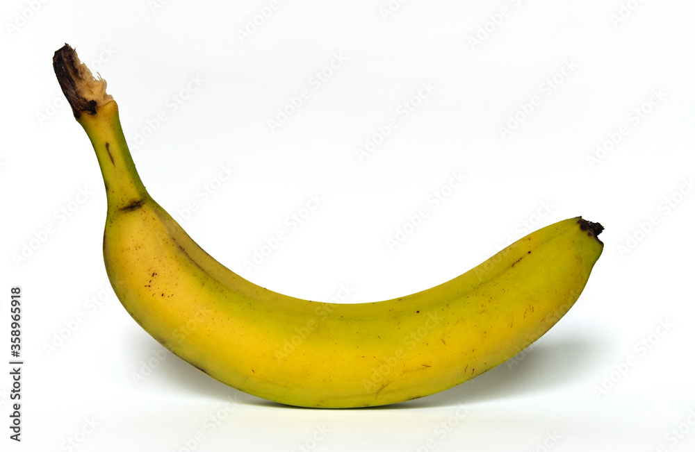 Single ripe banana isolated on white studio background Single ripe banana isolated on white studio background