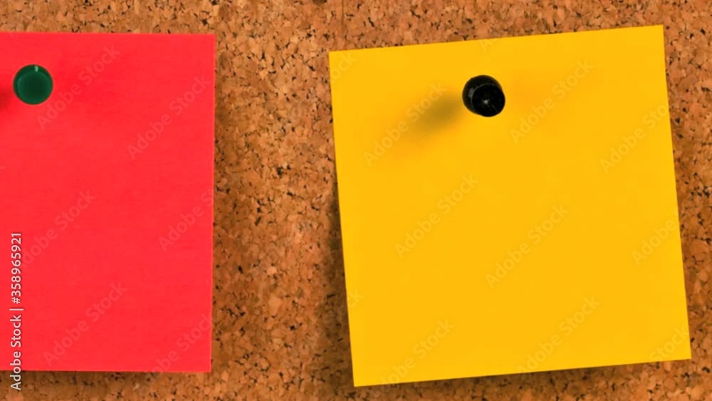 Pieces of note paper on a cork bulletin board