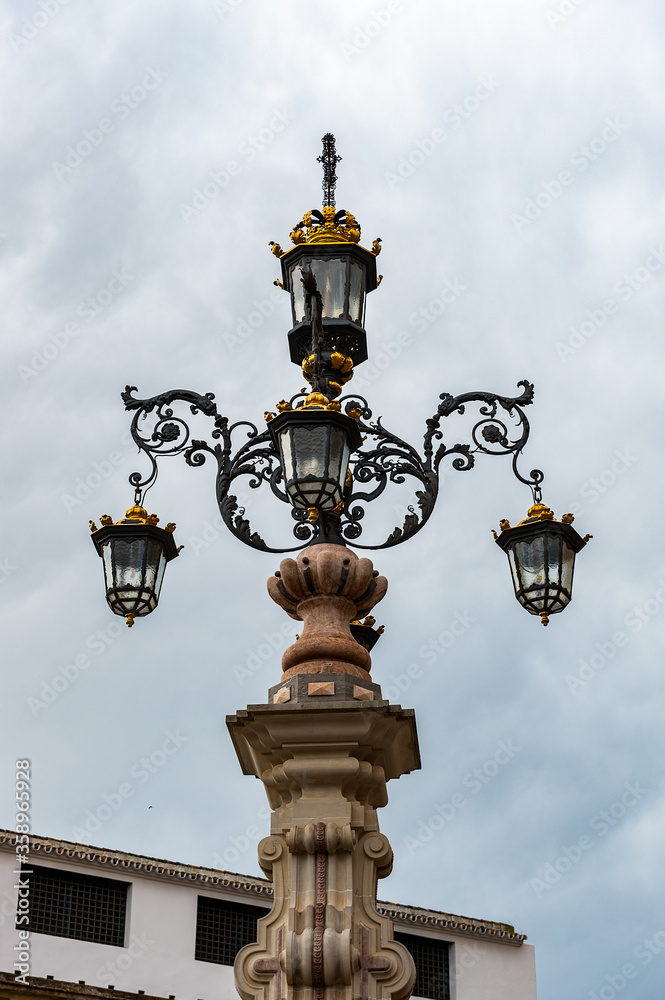 It's Lamp post near the Seville Cathedral, Roman Catholic cathedral in Seville,Spain. It's Lamp post near the Seville Cathedral, Roman Catholic cathedral in Seville,Spain.