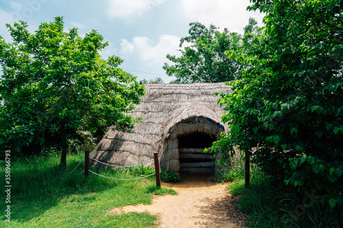 Straw hut traditional house at Ganghwa Dolmen park UNESCO World Heritage Site in Incheon, Korea photo