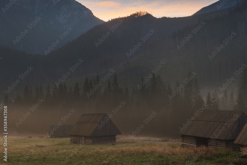 Amazing sunrise in calm mountain village, autumn