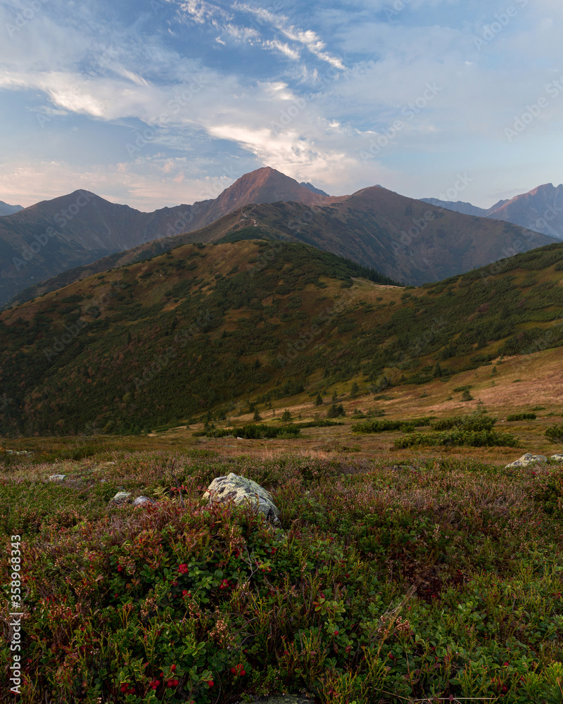 Fototapeta premium Amazing sunrise in calm mountain village, autumn