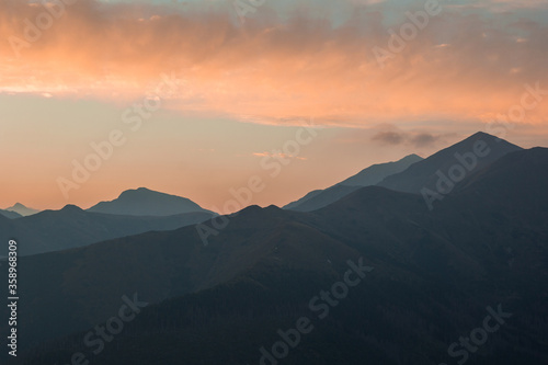 Colorful clouds at sunset above mountains in Poland