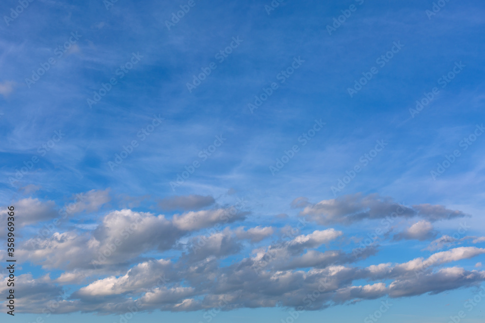 Gray clouds on blue sky background.
