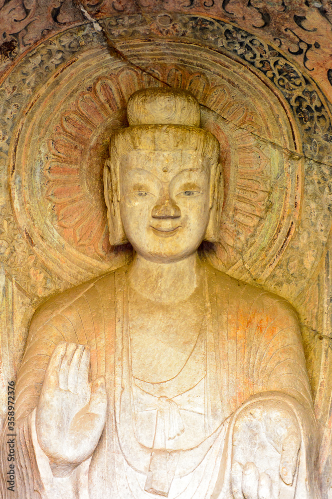 It's Buddha statue at the Longmen Grottoes ( Dragon's Gate Grottoes) or Longmen Caves.UNESCO World Heritage of tens of thousands of statues of Buddha and his disciples