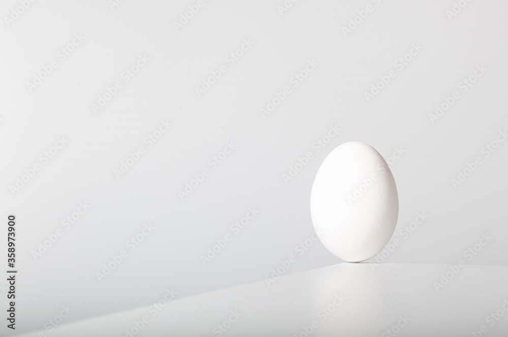 White egg balances on the edge