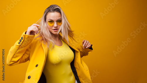 Fotografie Stylish bright young woman dancing and rejoicing
