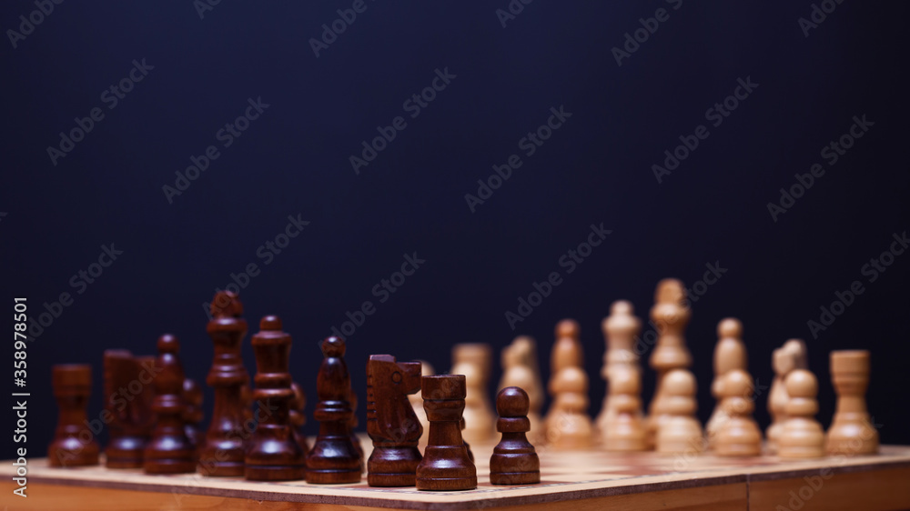 A game of chess, the beginning of a chess game two sides opposite each other. A game of chess, the beginning of a chess game two sides opposite each other.