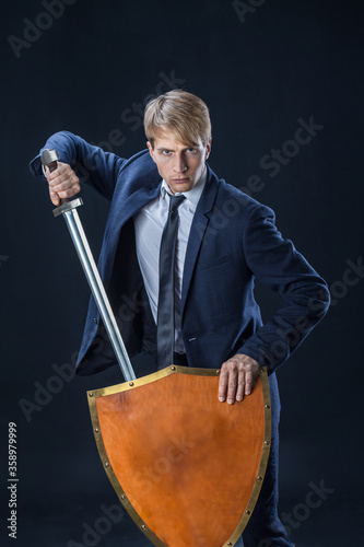 A man in a suit with a shield and a sword, antivirus, personal data protection, concept.