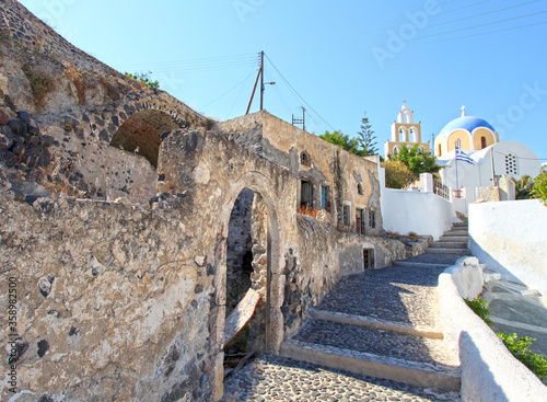 Old derelict houses in the village of  Vothanos in central Santorini, Greece. photo