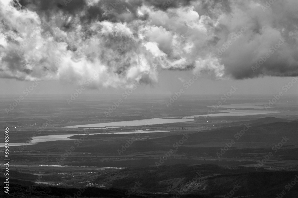 fluffy clouds on the sky. cloudy day in the forest