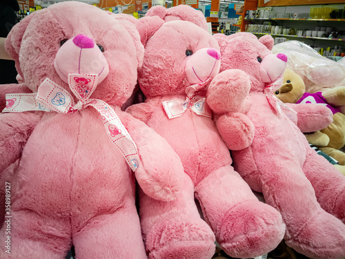 Pink Teddy bears lie on the counter of the shopping center