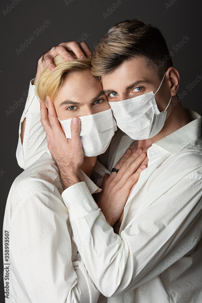 masked gay couple, hugs of men in white shirts