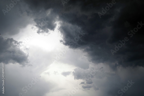 Dark thunderclouds on a gray sky. Weather forecast. Thunderstorm and storm..