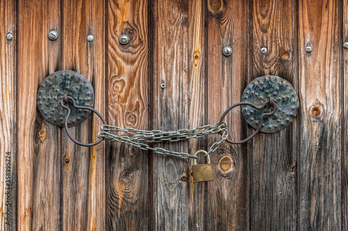The Antique doorknob and the lock on the chain