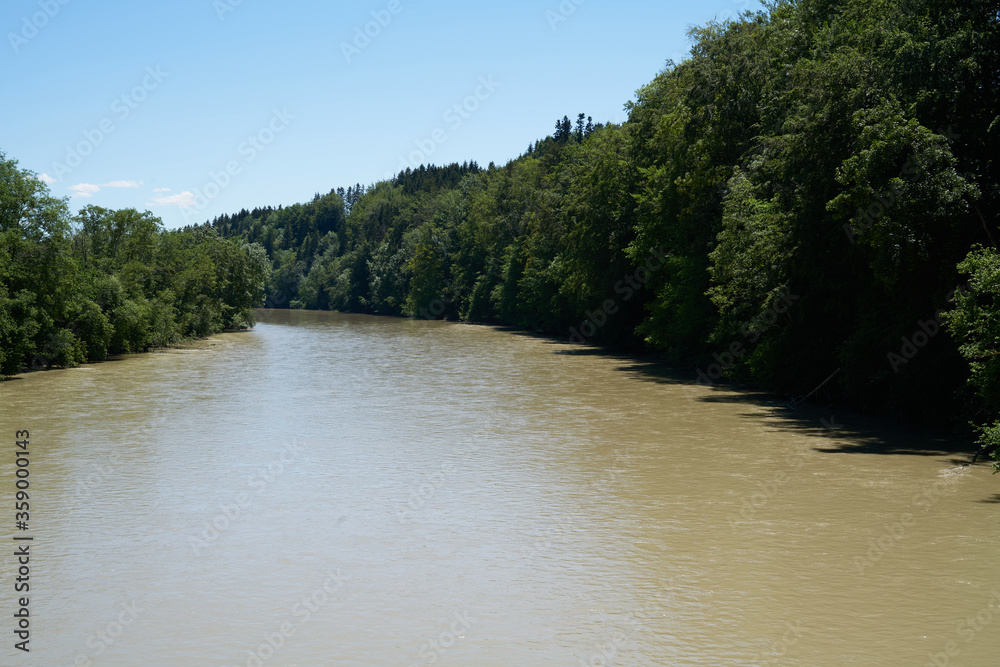 Iller river in bavaria after rain with muddy water in a nature park Iller river in bavaria after rain with muddy water in a nature park