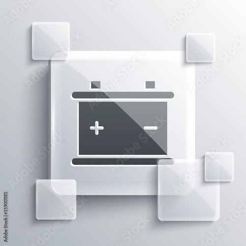 Grey Car battery icon isolated on grey background. Accumulator battery energy power and electricity accumulator battery. Square glass panels. Vector Illustration.