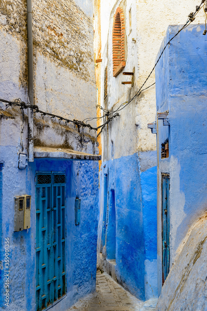 It's Blue wall of Chefchaouen, small town in northwest Morocco famous by its blue buildings It's Blue wall of Chefchaouen, small town in northwest Morocco famous by its blue buildings