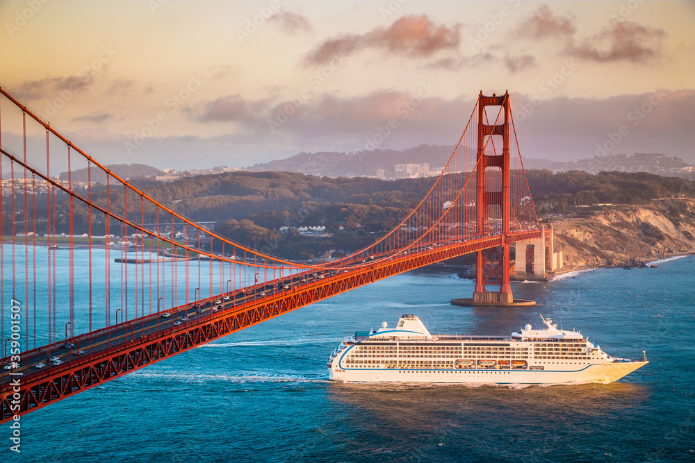 Golden Gate Bridge with cruise ship at sunset, San Francisco, California, USA