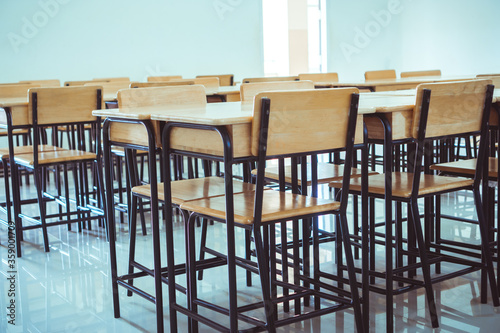 Lecture school empty classroom with desks chair iron wood when student close stay at home in high school © smolaw11