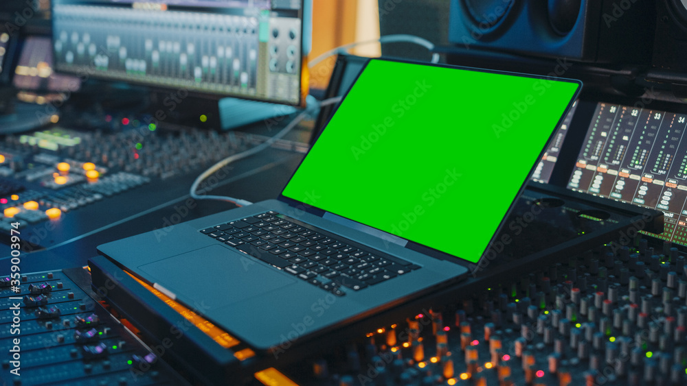 Female Artist, Musician, Producer, Audio Engineer Working in Music Record Studio on a New Album, Use Green Screen Laptop Computer, Control Desk for Mixing and Creating Hit Song