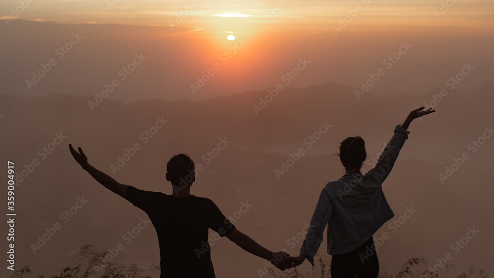 Fototapeta premium portrait. lovers cuddle at dawn on the volcano Batur. Bali Indonesia