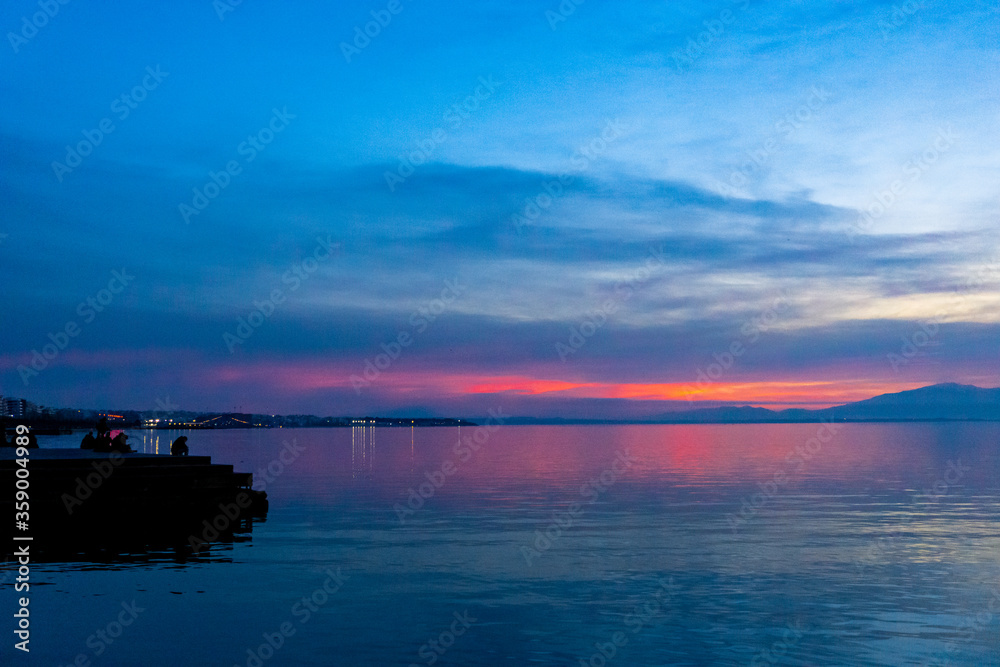 Sunset over the seafront of Thessaloniki withe pink and blue sky Sunset over the seafront of Thessaloniki withe pink and blue sky