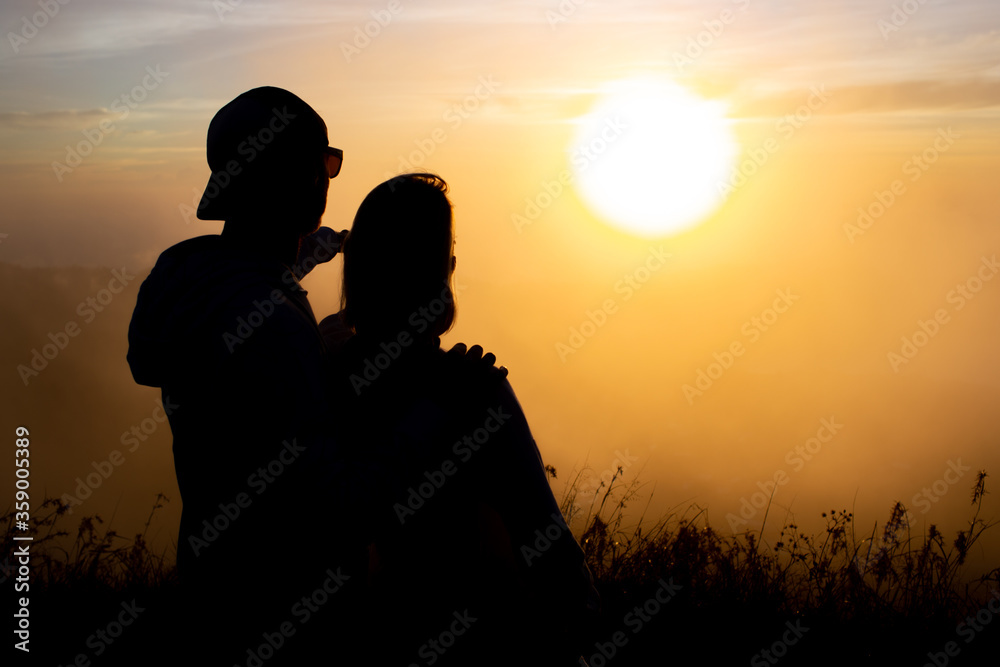 portrait. lovers cuddle at dawn on the volcano Batur. Bali Indonesia