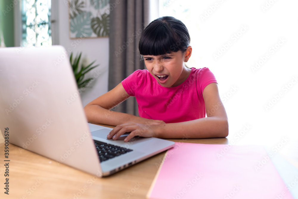 girl watching something disgusting her on a computer at home girl watching something disgusting her on a computer at home