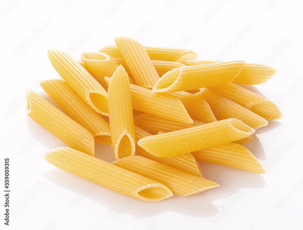 non-cooked Penne paste isolated on a white background non-cooked Penne paste isolated on a white background